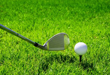 Ball and golf clubs clipart