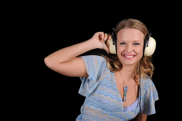Młoda dziewczyna ze słuchawkami — Zdjęcie stockowe