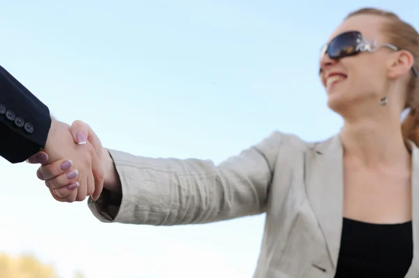 Shaking hands on a light background — Stock Photo, Image