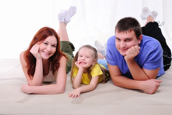 Mother, a young father and young daughter — Stock Photo, Image