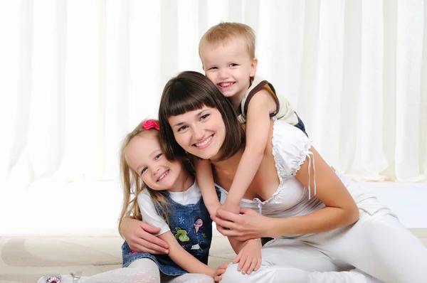 Young mother, her daughter and son — Stock Photo, Image