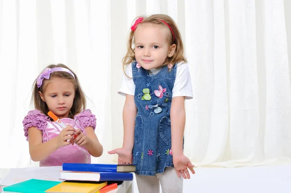 Little girls are studying literature — Stock Photo, Image