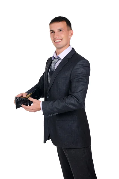 Geschäftsmann blickt auf seine leere Brieftasche — Stockfoto