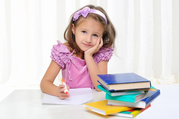 Little girl is studying literature — Stock Photo, Image