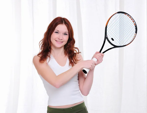 Młoda dziewczyna z rakietą tenisową — Zdjęcie stockowe