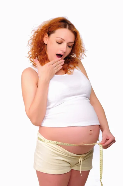 stock image Young pregnant mom measure