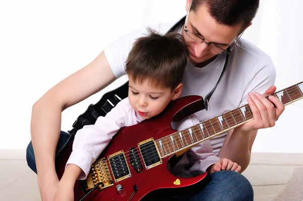 Young father teaches his young son — Stock Photo, Image