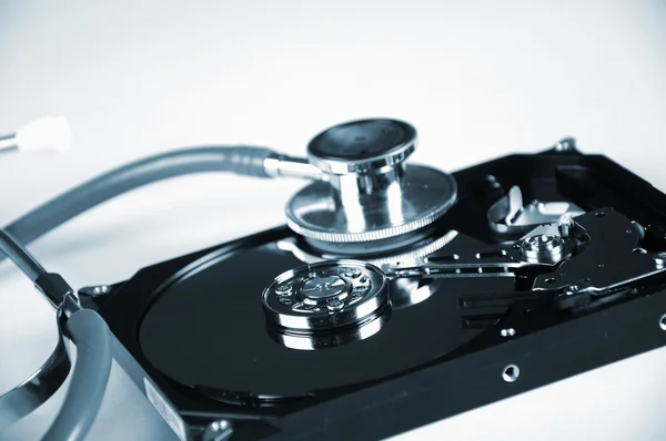 Computer hard drive and a stethoscope. — Stock Photo, Image