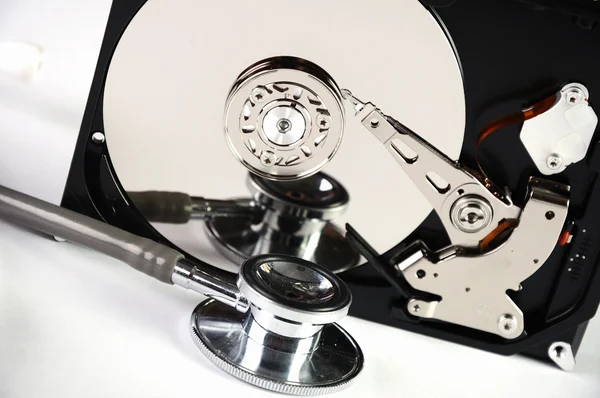 stock image Computer hard drive and a stethoscope.