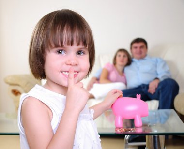 Little girl hides her money clipart