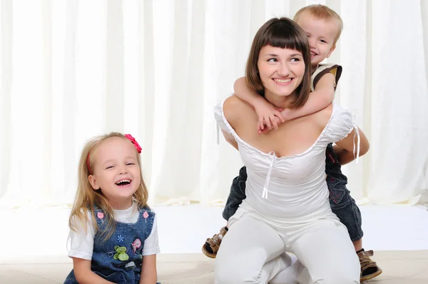 Young mother, her daughter and son — Stock Photo, Image