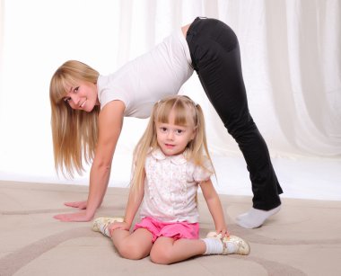 Little girl and her mother clipart