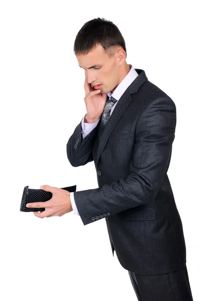 Hombre de negocios mirando su cartera vacía — Foto de Stock