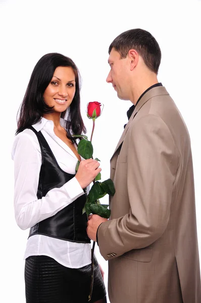 Young man gives his girlfriend a rose — Stock Photo, Image