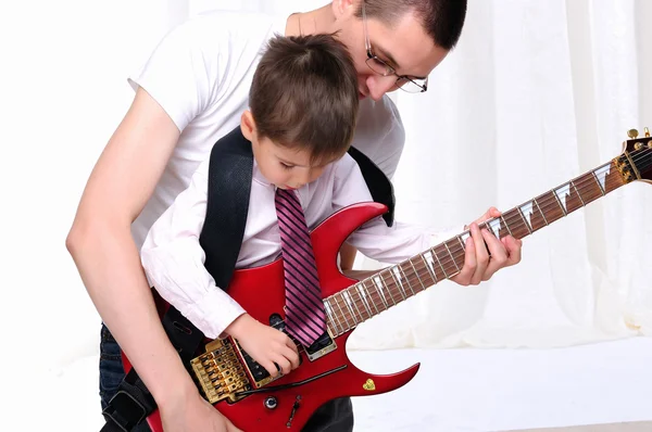 Young father teaches his young son — Stock Photo, Image