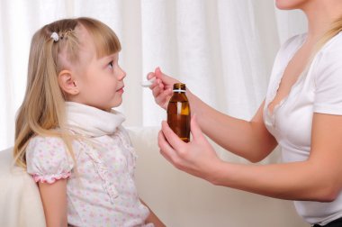 Little girl drinking cough syrup clipart