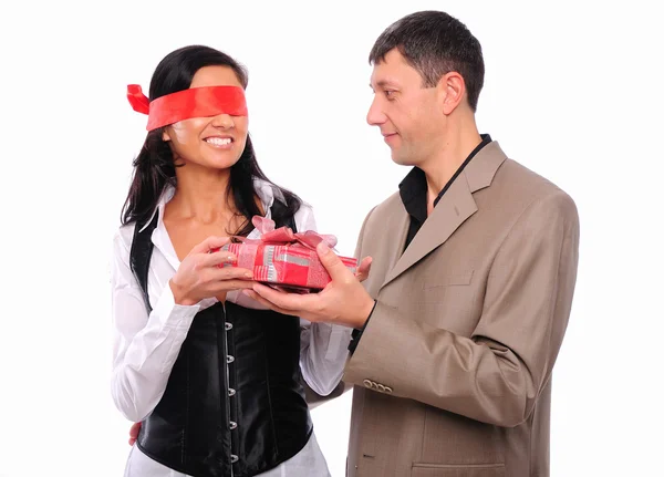 Young man gives his girlfriend a gift — Stock Photo, Image