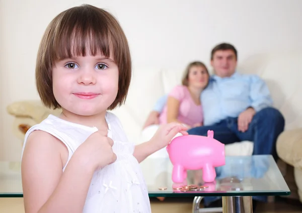 Little girl hides her money — Stock Photo, Image