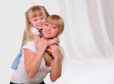 Little girl and her mother clipart