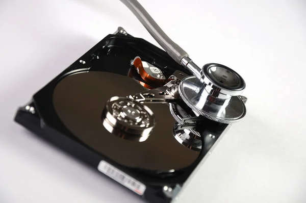 Stock image Computer hard drive and a stethoscope.