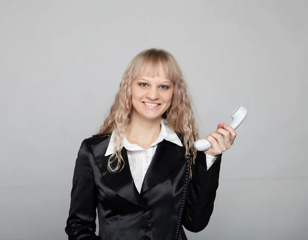 Funny zakenvrouw in een zwart pak — Stockfoto