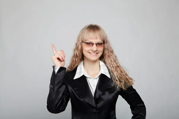 Mujer de negocios divertida en un traje negro —  Fotos de Stock