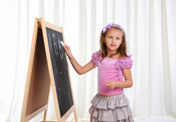 Little girl wrote in chalk — Stock Photo, Image