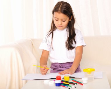 Little girl draws paint clipart