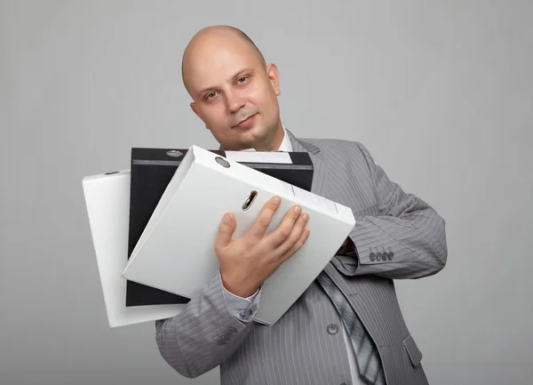 Bald businessman in a gray suit — Stockfoto