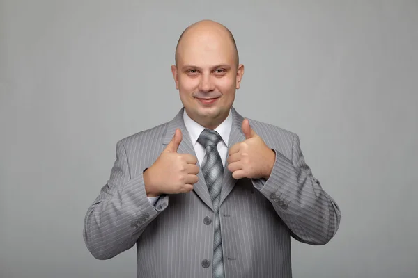 Hombre de negocios calvo con un traje gris —  Fotos de Stock