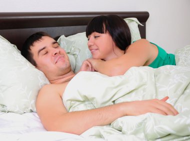 Young couple had just woken up clipart