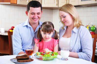 Dad, Mom and their little daughter clipart