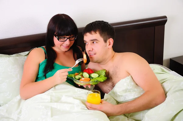Young couple at breakfast — Stock Photo, Image