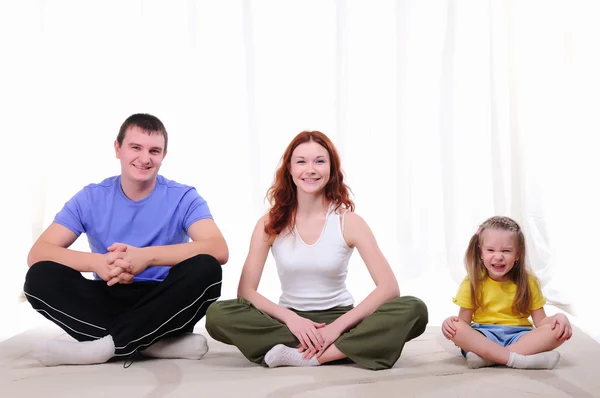 Mother, a young father and young daughter — Stock Photo, Image
