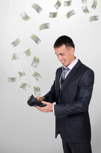 Junger Mann mit Geldbörse — Stockfoto