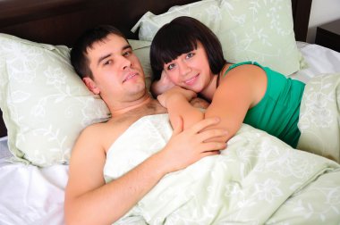 Young couple had just woken up clipart