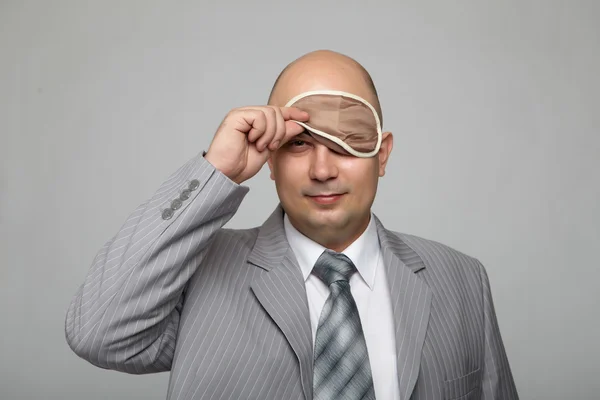 Bald businessman in a gray suit — Stok fotoğraf