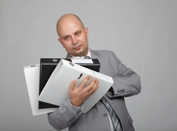 Skallig affärsman i grå kostym — Stockfoto
