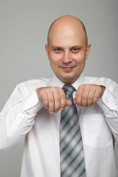 Bald businessman in a gray suit — Stok fotoğraf