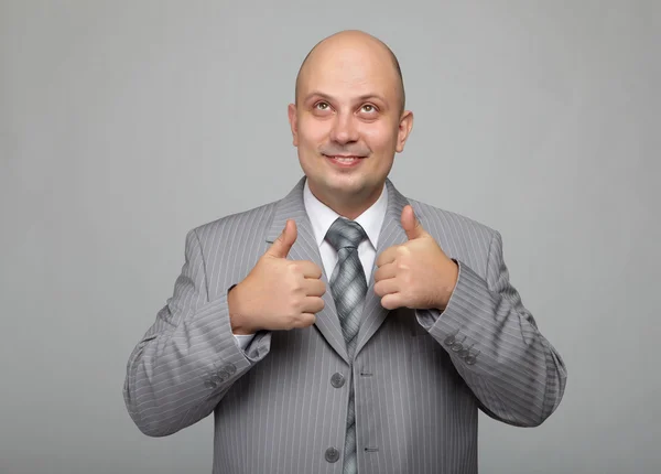 Bald businessman in a gray suit — Stock Photo, Image