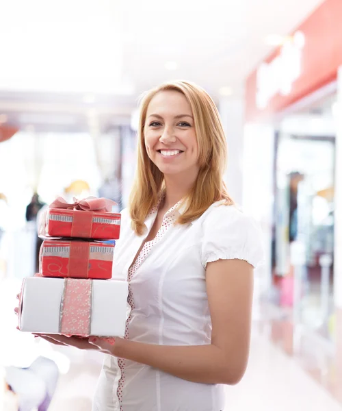 Young girl with gift boxes — Stock Photo, Image