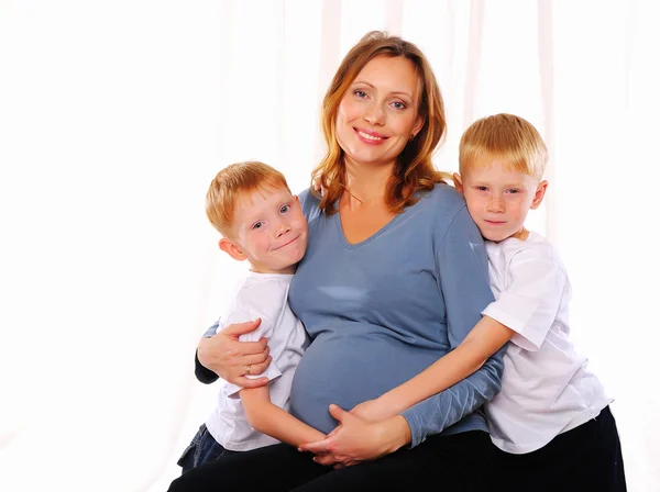 Two red brothers and their pregnant — Stock Photo, Image