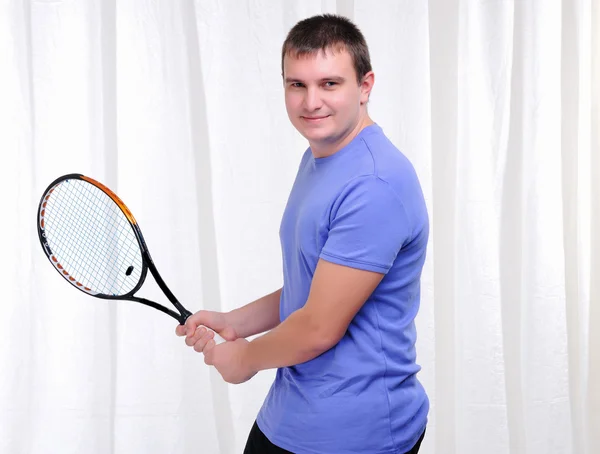 Young man with tennis racket — Stock Photo, Image