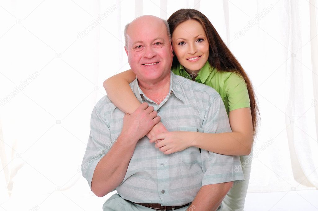 An elderly father and daughter together. Symbol of the family.