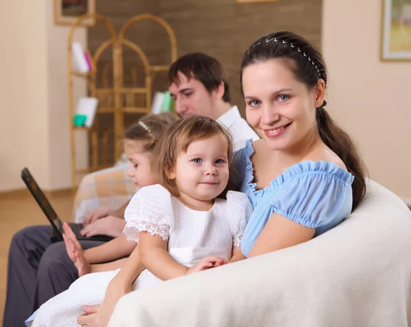 Young family at home with a daughter — Stock Photo, Image