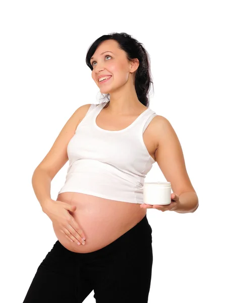 Молодая Беременная Мама Использует Косметический Крем — стоковое фото