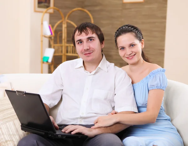 Young Couple Working Laptop Computer Sitting Sofa Home — Stock Fotó