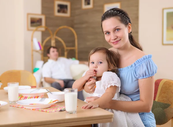 Young mother feeding her baby — Stock Photo, Image