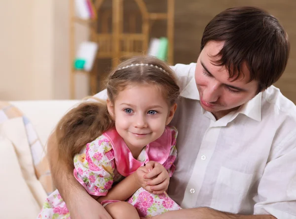 stock image Young family with a daughter at home in the living-room