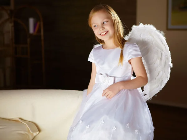 stock image A little girl in white dress with angel's wings